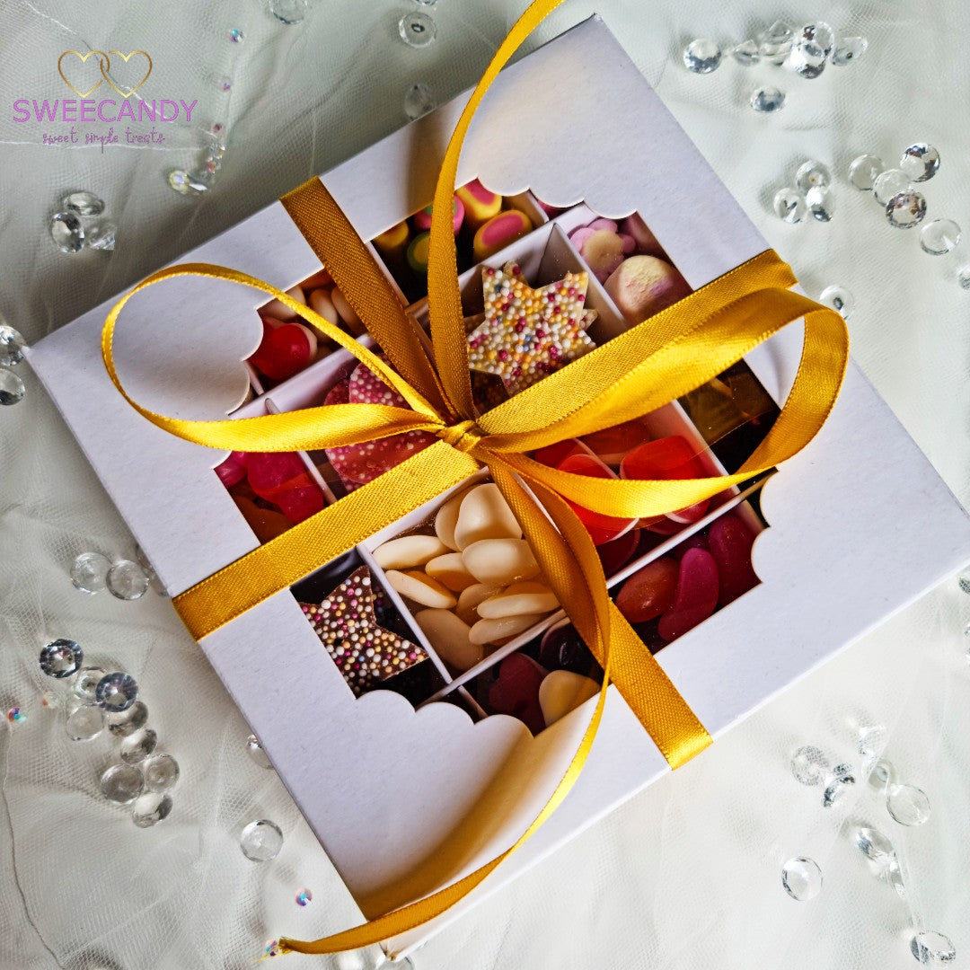 Wedding sweet box full of sweets in a wedding veil with Golden Ribbon